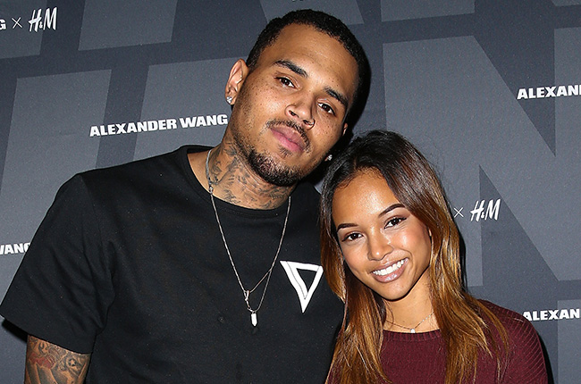 Chris Brown smiles at a public appearance ahead of welcoming his fourth child with Jada Wallace