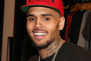 What led to gunfire near Chris Brown's LA home?